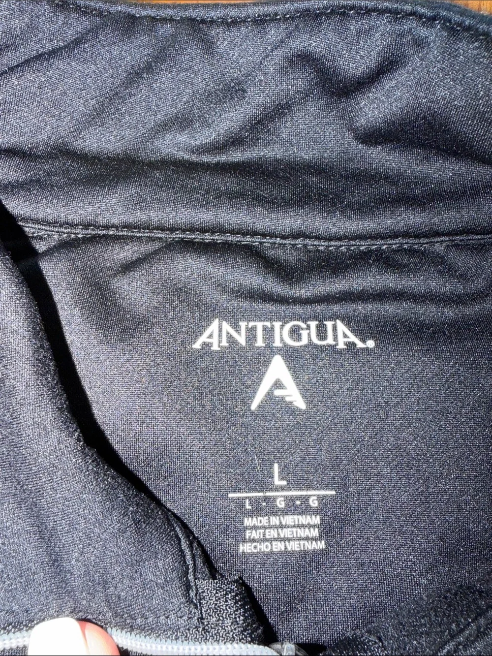 Antigua Black Quarter-Zip Pullover with Gray Shoulder Accents and Team Crest